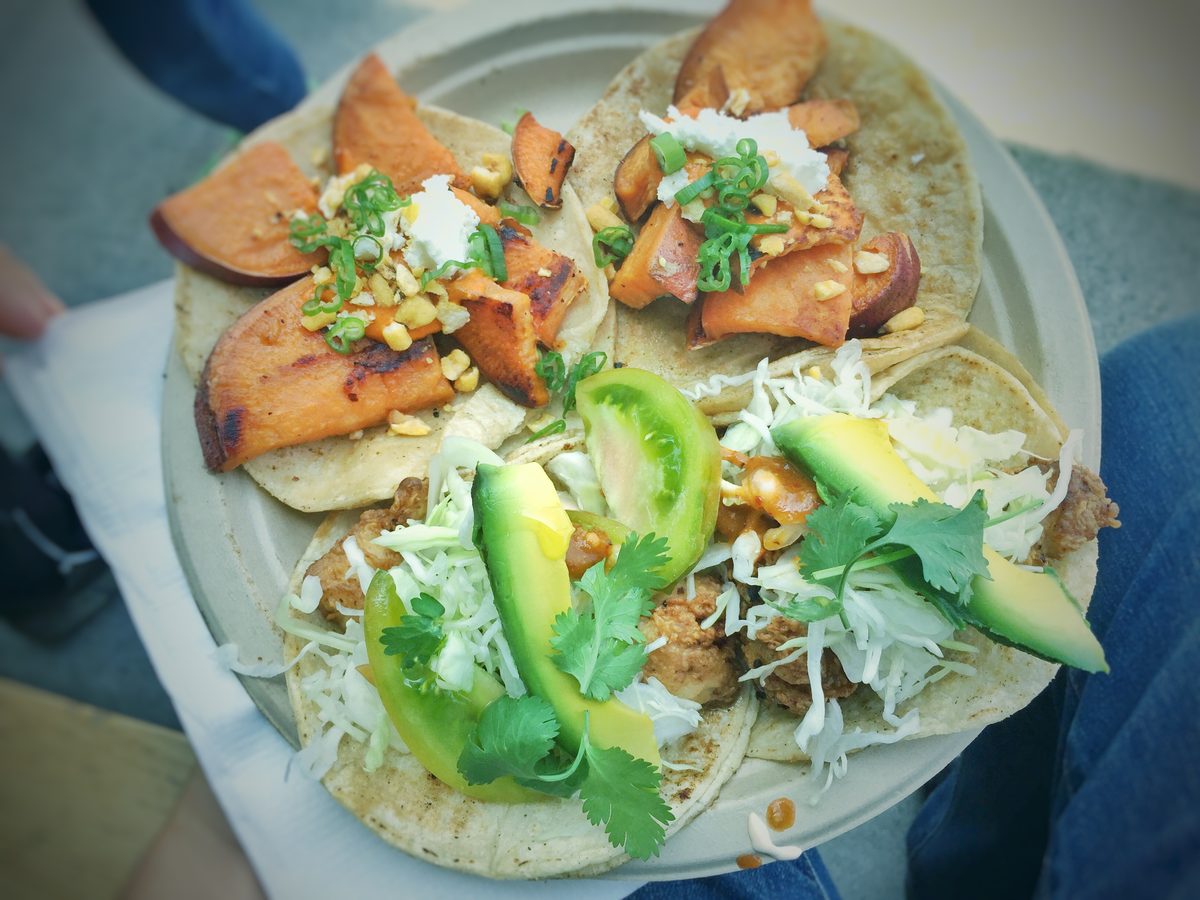 Grilled fish tacos with slaw and lime on a plate