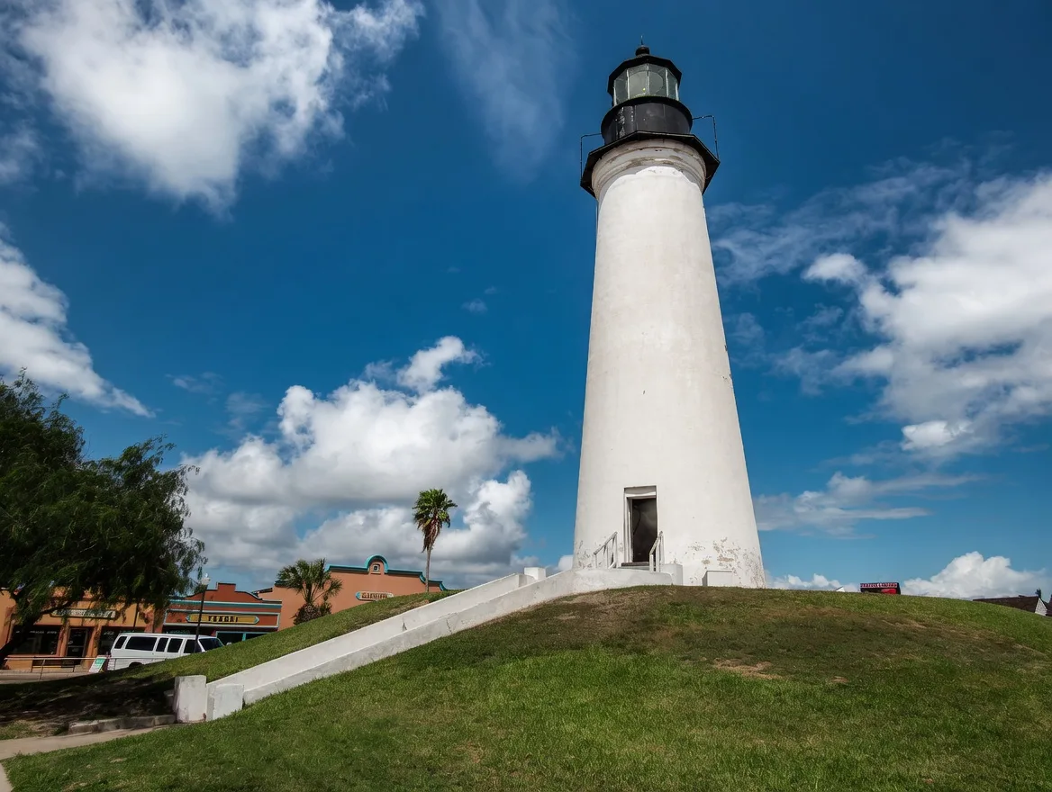 Port Isabel Lighthouse against a blue sky with clouds